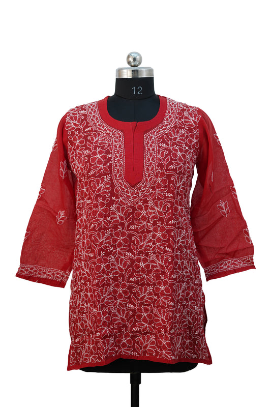 Red embroidered kurta on a mannequin against a white background