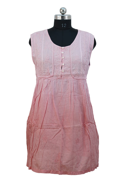 Pink sleeveless dress on a mannequin against a white background